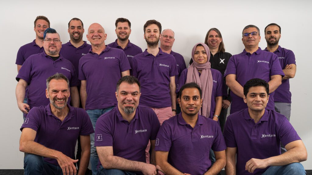 Group photo of the team at Xentara by Embedded Ocean, showing team members smiling and standing together.